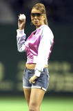 Mariah Carey shows legs in short jeans shorts and peek of cleavage wearing unzipped jacket as she throws the ceremonial first pitch before Japanese professional baseball match at Tokyo Dome in Tokyo