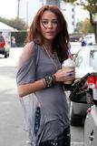 th_90355_Preppie_-_Miley_Cyrus_gets_morning_coffee_before_heading_to_Beverly_Hills_-_Jan._9_2010_7238_122_43lo.jpg